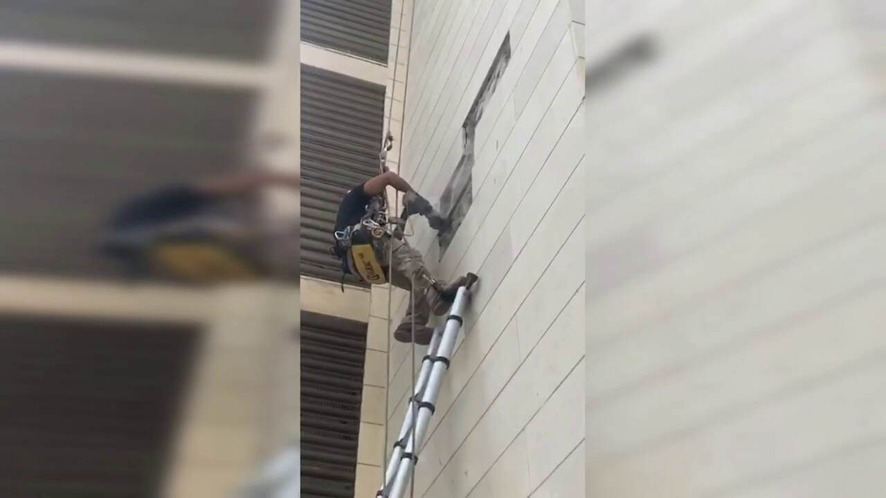 חיזוק אריחים בבניין והחלפת אבנים רופפות בחזית